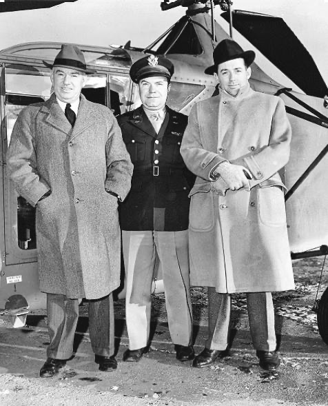 Left to Right: B.L. Whelan, Capt. J. E. Beighle, E. L. Eveleth