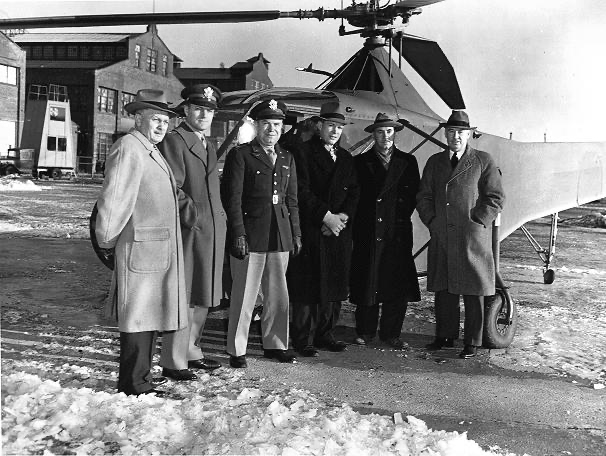 Left to Right:
M. F. Moore (Prod. Eng. Manager), Major A. C. Bostwick (AAF Resident Representative), Capt. J. E. Beighle (Operations Officer), J. L. Brown, Jr. (Factory Manager), I. I. Sikorsky (Engineering Manager), B. L. Whelan (General Manager)