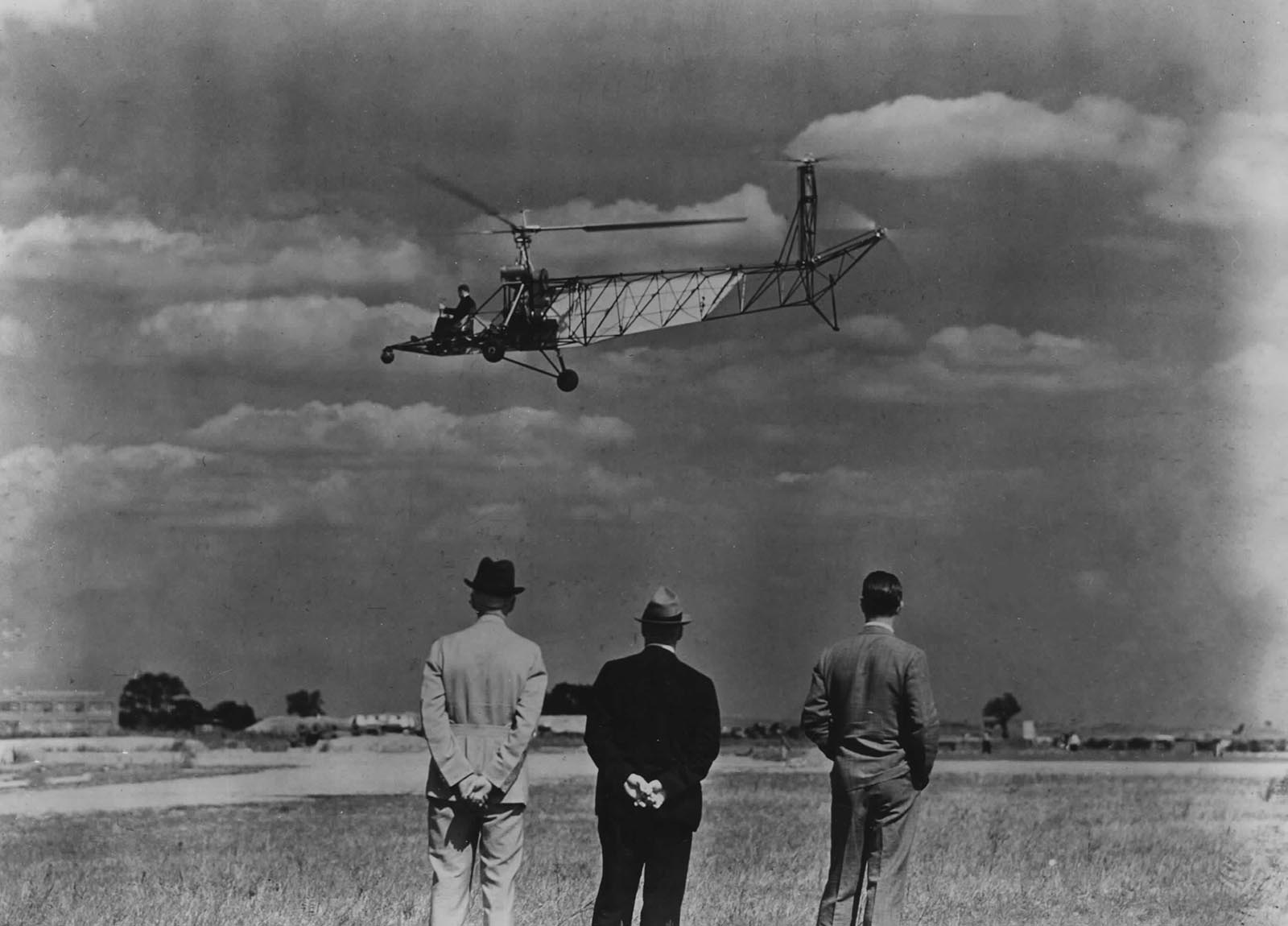 Charles Lester Morris at the controls of the third VS-300 configuration, above the meadow next to the Sikorsky factory.